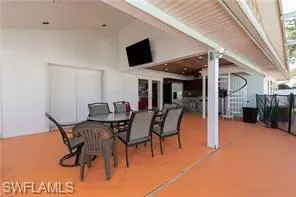 View of patio with outdoor dining area
