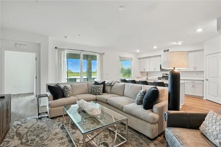 Living room featuring light wood-style floors and recessed lighting