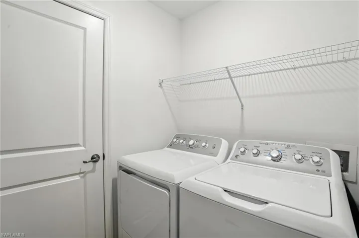 Laundry room featuring washing machine and clothes dryer