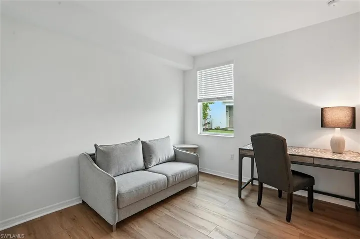 Office with light wood finished floors and baseboards
