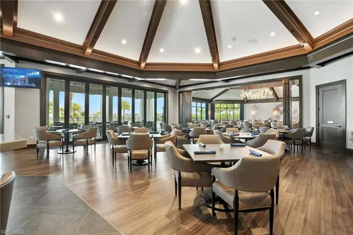 Community lobby with beamed ceiling and high vaulted ceiling