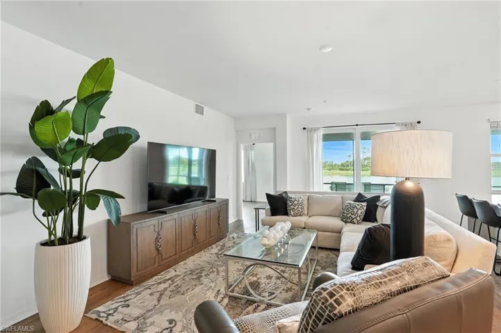 Living area featuring light wood finished floors and baseboards