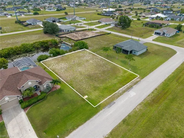 Cleared residential lot featuring a flat topography and partial canal frontage