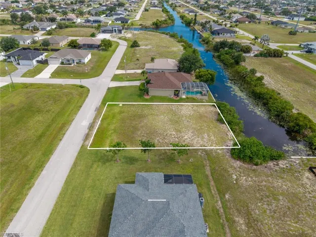 Vacant residential lot featuring direct canal frontage