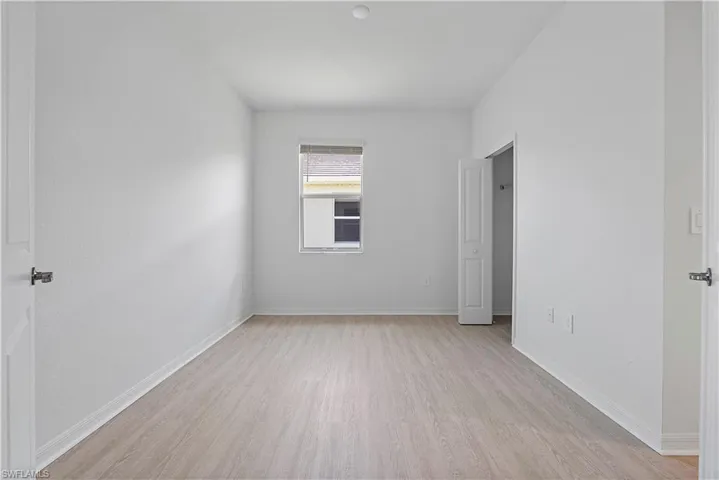 Spare room with light wood-type flooring