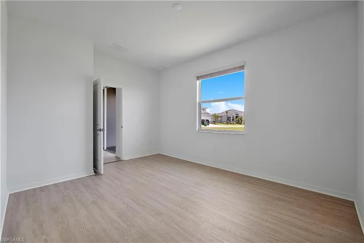 Spare room featuring light hardwood / wood-style floors