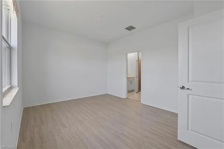 Spare room featuring light hardwood / wood-style flooring