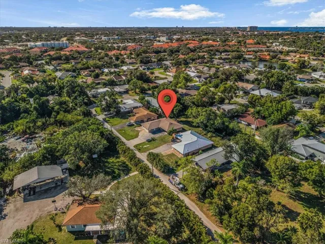 Aerial overview of property's location with nearby suburban area