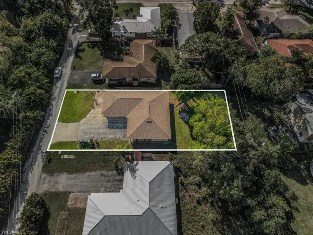 Aerial perspective of suburban area with property parcel outlined