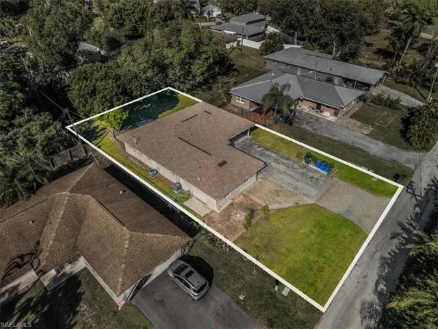 Aerial perspective of suburban area with property parcel outlined