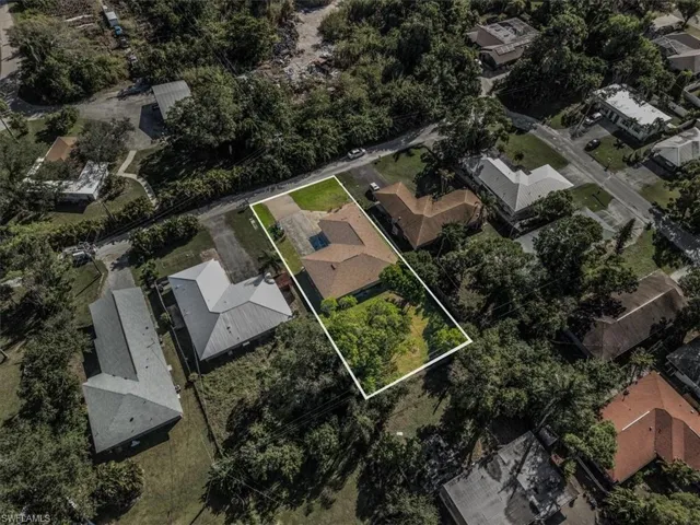Aerial view of residential area with property parcel outlined