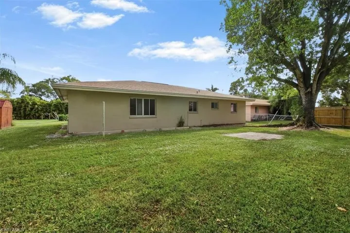 Rear view of house featuring stucco siding