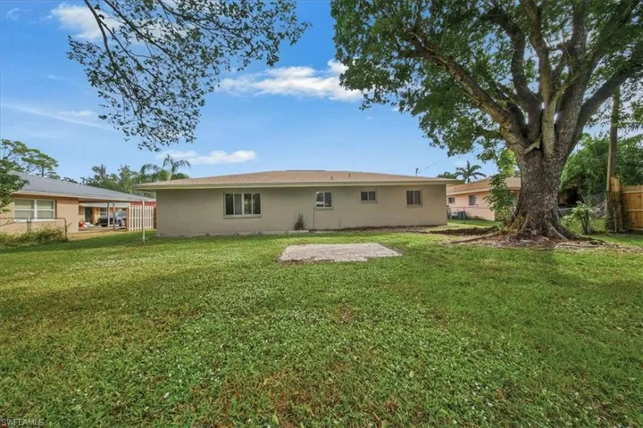 Rear view of property featuring stucco siding