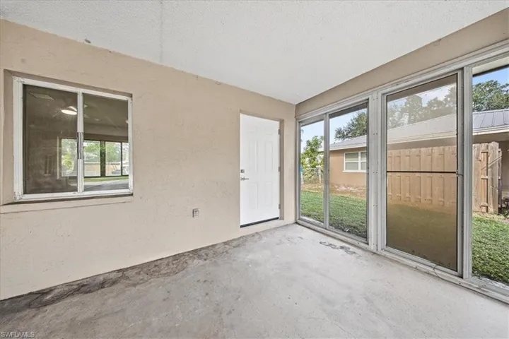 Unfurnished sunroom featuring plenty of natural light