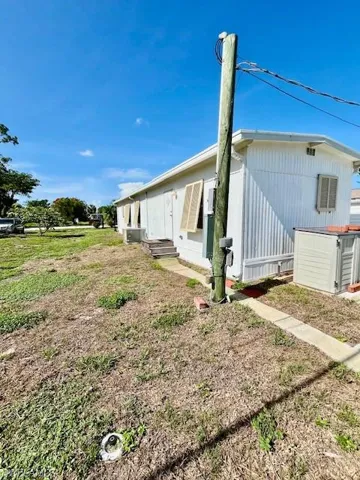 View of property exterior with entry steps