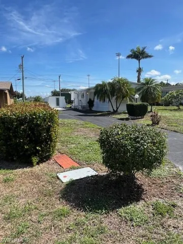 View of the yard with the driveway
