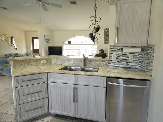 Kitchen peninsula overlooks the spacious living room and is open to the dining area