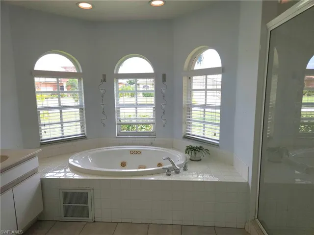 Sunshine-filled bathroom with Whirlpool tub for those lazy baths!