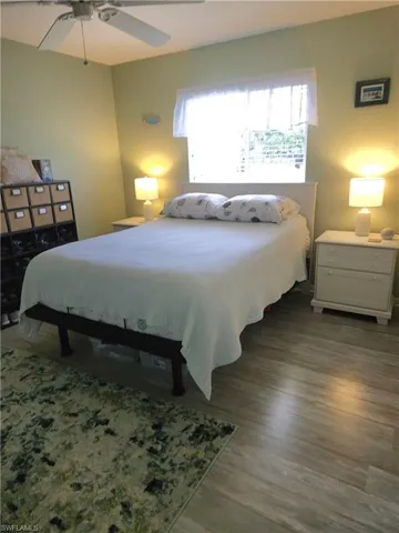 Queen-sized Bedroom #3 with ceiling fan, double-wide closet and laminated wood-type plank flooring. Either bedroom would make a large office.