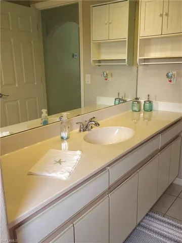 Bathroom with a wide vanity with plenty of room for essentials.