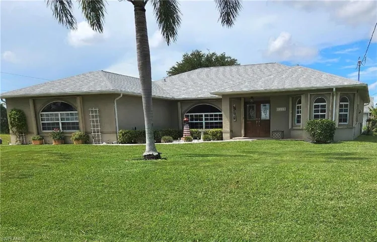 Ranch-style home with a front yard
