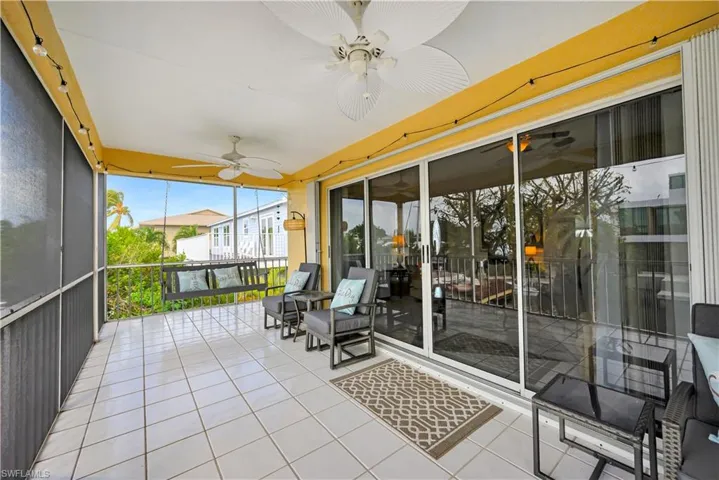 Sunroom featuring ceiling fan