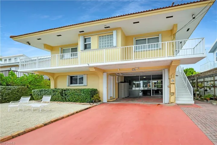 Back of house featuring a balcony