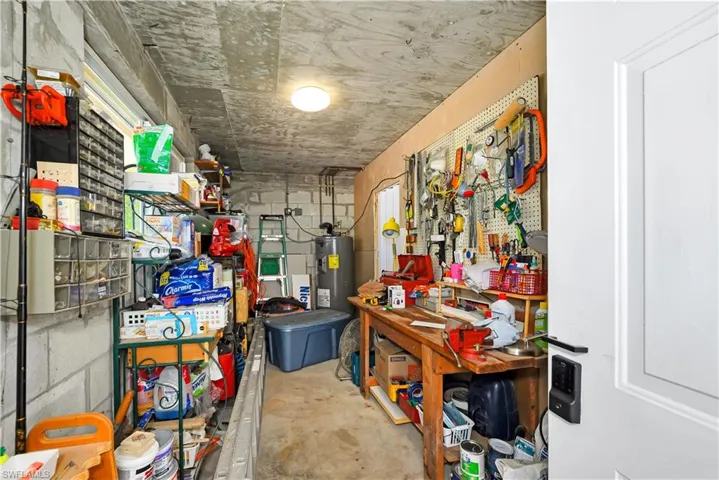 Storage area featuring water heater
