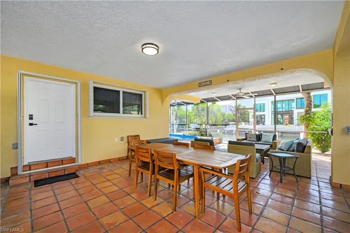 Dining room featuring tile patterned flooring and a textured ceiling
