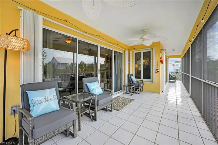 Sunroom / solarium featuring a wealth of natural light and ceiling fan