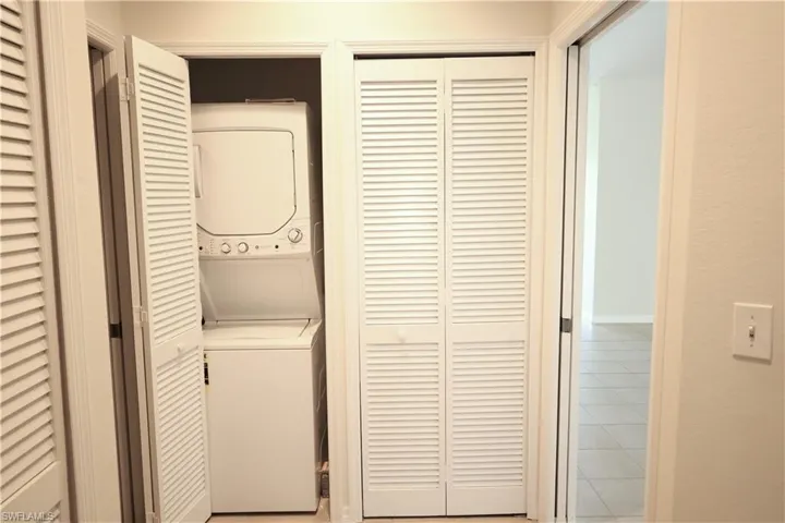 Stack-able washer/dryer in residence.