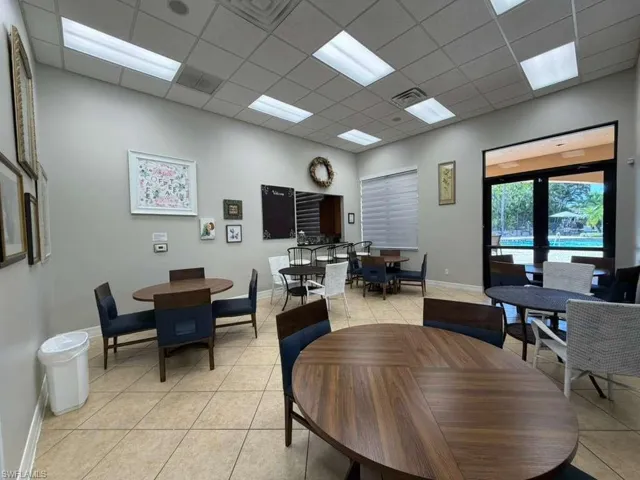 Dining room featuring a drop ceiling and light tile patterned floors