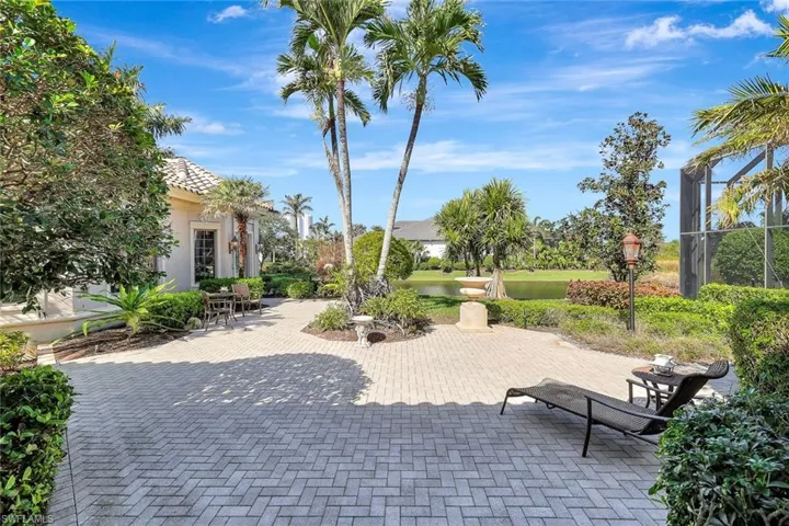 View of property's community featuring a water view and a patio