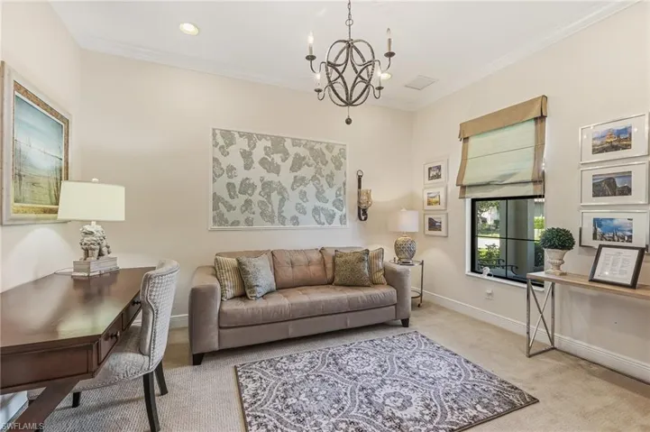 Interior room with light-toned walls, recessed lighting, and crown molding