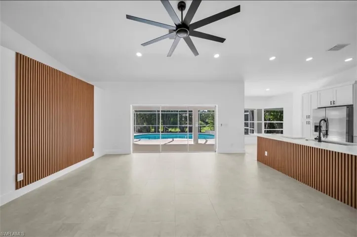 Unfurnished living room with recessed lighting and a ceiling fan