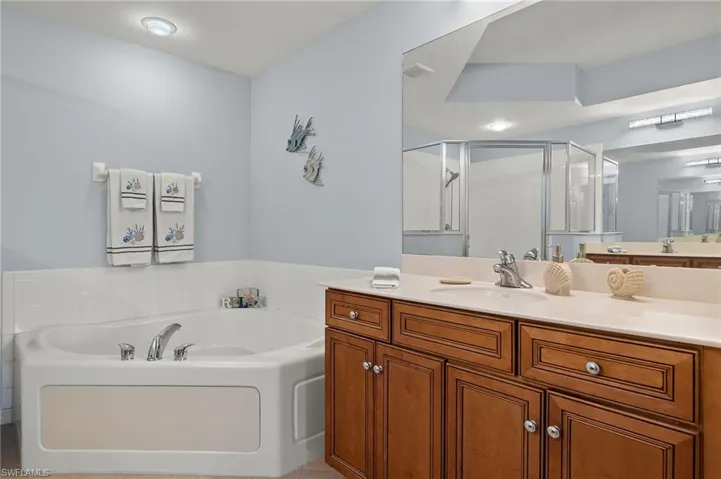 Primary Bath w/ separate tub and shower, two vanities