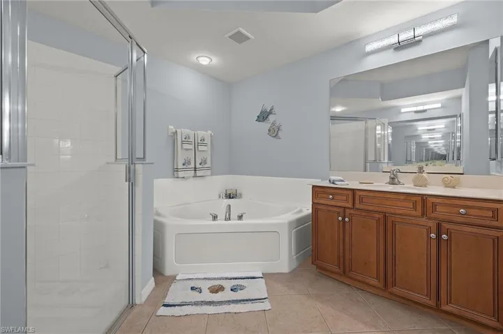 Primary Bath w/ separate tub and shower, two vanities