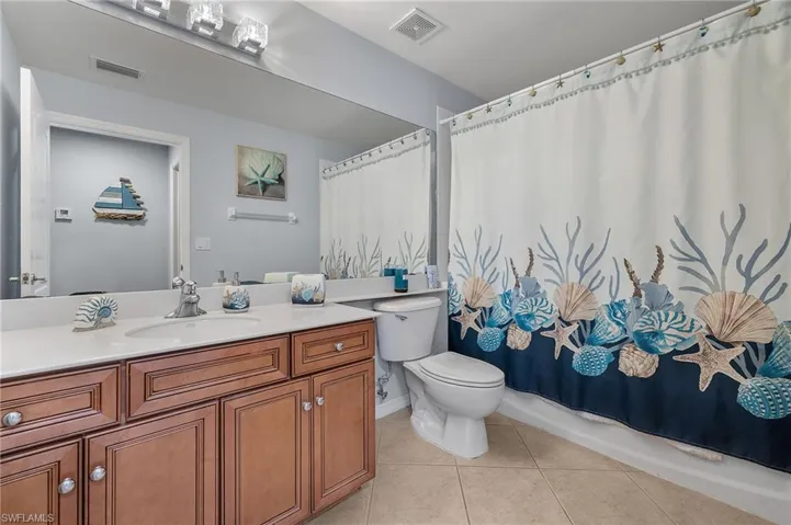 Guest Bathroom w/ tub and shower combo, single vanity