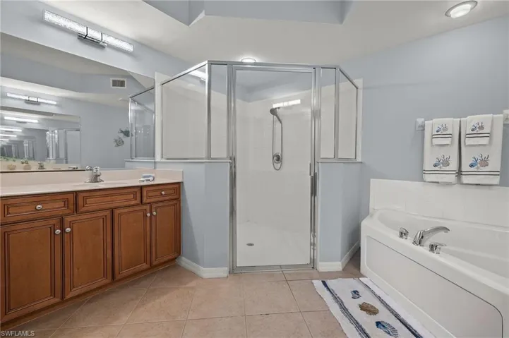 Primary Bath w/ separate tub and shower, two vanities