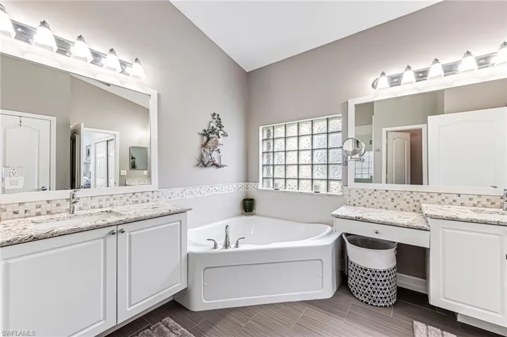 Primary bath with natural light and soaking tub