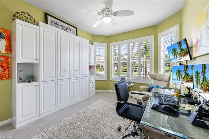 Bedroom/Office with murphy bed and new impact windows and plantation shutters