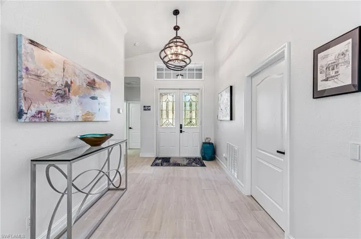 Bright, open entry way with exquisite lighting