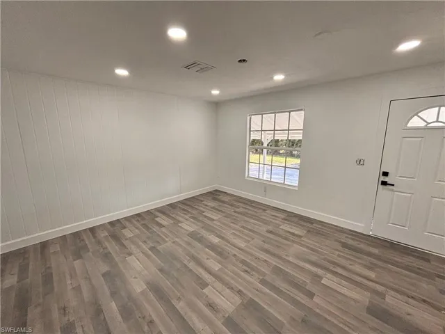 Entryway featuring recessed lighting and dark wood-style flooring