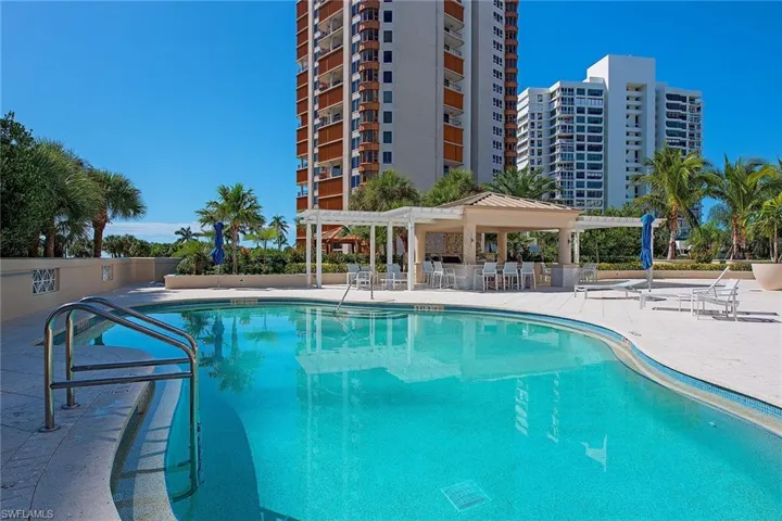 Community pool with a patio area