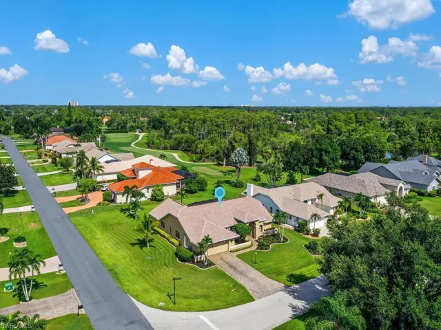Aerial perspective of suburban area with a golf course