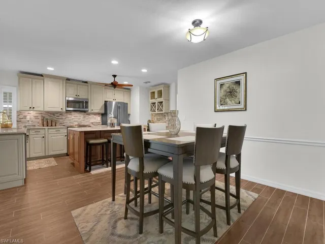 Dining room featuring wood finished floors and baseboards