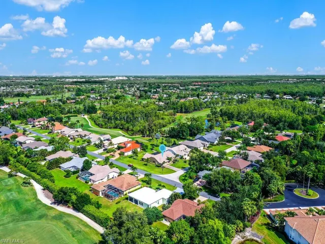 Aerial view of residential area with a local golf course