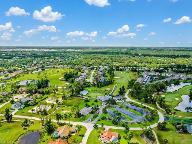 Aerial overview of property's location featuring nearby suburban area and a local golf course