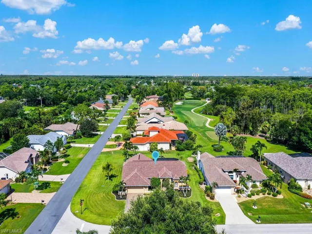 Aerial view of residential area with a local golf course