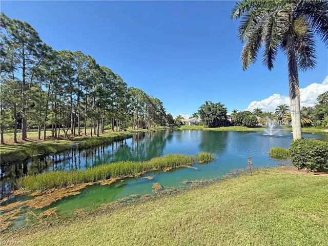 Long lake view with water fountain
